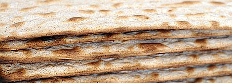 A piece of matzah during Passover  of the ritual Pesach meal called a Seder (order)  —Exodus 34:18; 1 Corinthians 5:8